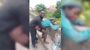 African woman fucks her man in public